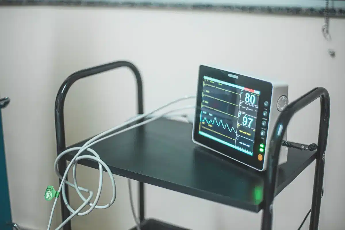 Patient receiving electrocardiogram test in medical setting