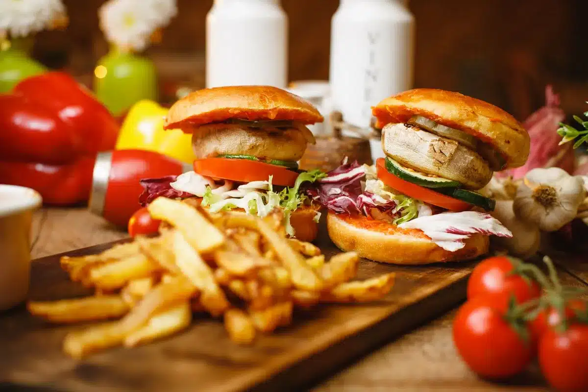 A homemade burger with lean beef, fresh vegetables, and whole grain bun