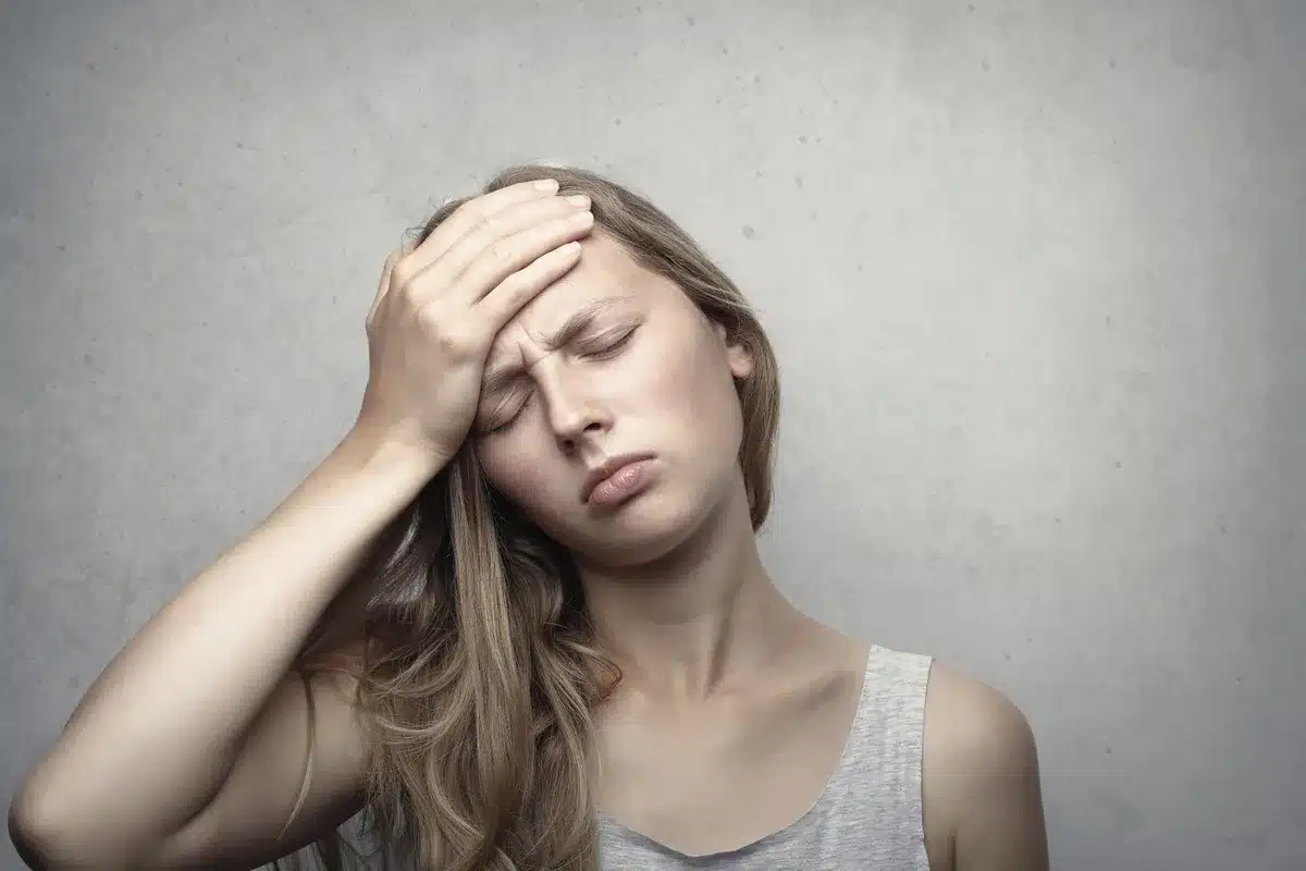 Person looking fatigued, illustrating potential effects of restrictive eating patterns