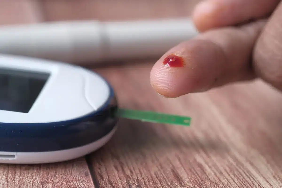Healthcare professional taking blood sample for metabolic testing