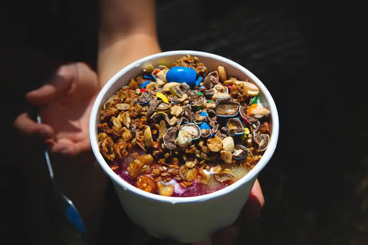 Fresh mulberries served in a bowl with yogurt and other toppings