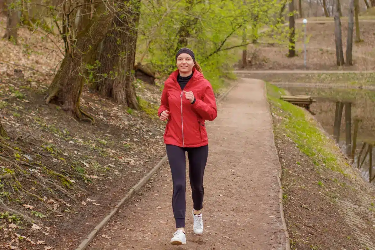 Woman jogging outdoors on a path during an aerobic exercise session