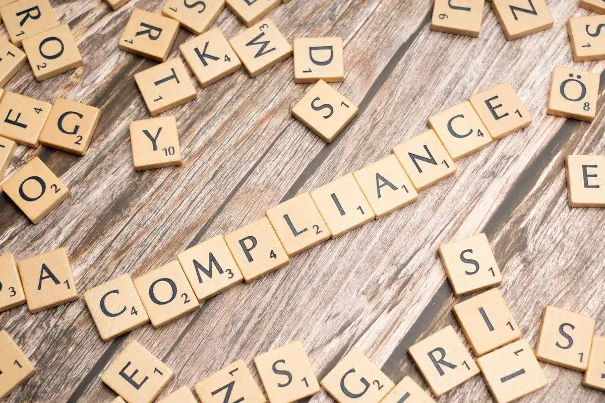 Pharmaceutical regulatory documents and compliance paperwork on a desk