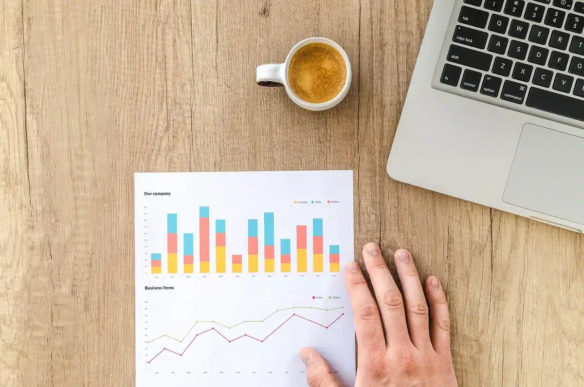 Researchers examining trial charts and survival curves at an oncology meeting