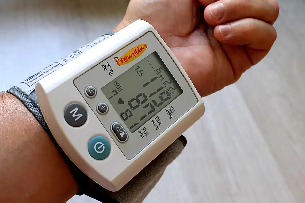 Home blood pressure cuff on a table in daylight