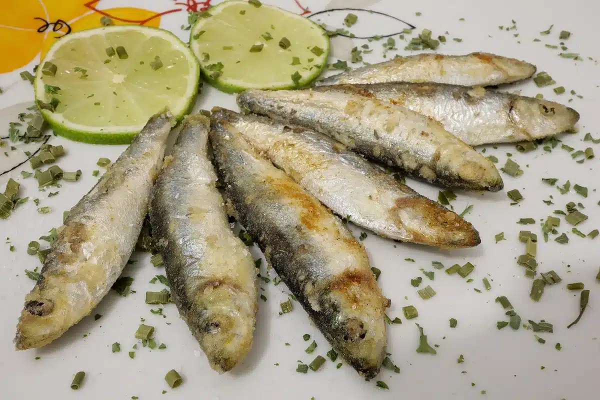 Canned sardines mashed on whole-grain toast with lemon