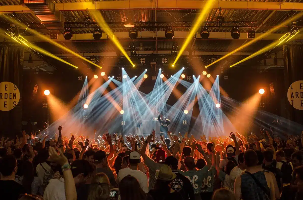 Crowd of smartphone screens showing a live video in a public setting
